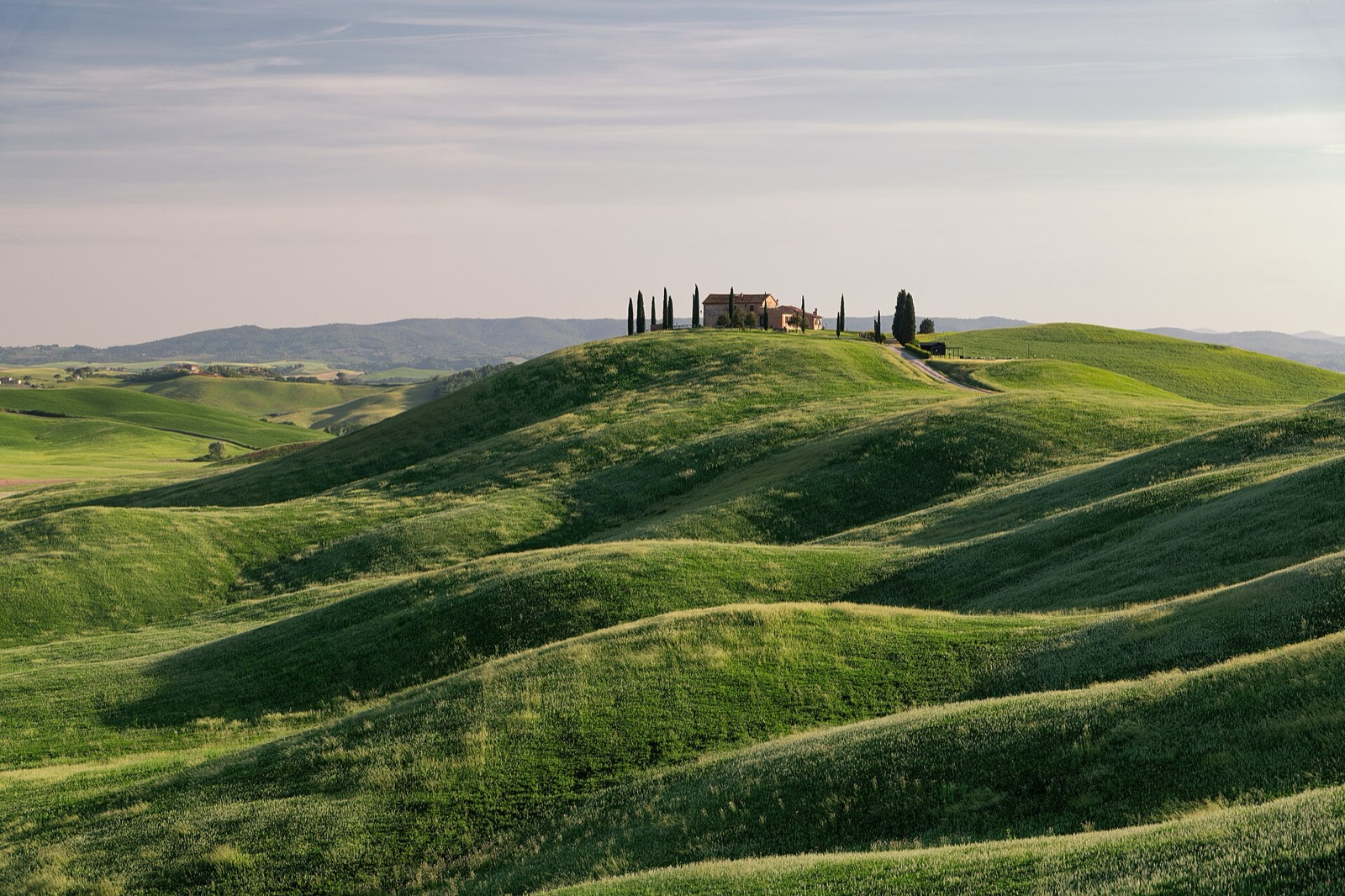 Rolling Tuscan hills at sunset